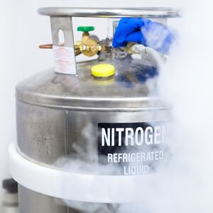 Huge tank of nitrogen half covered by fume caused by evaporation