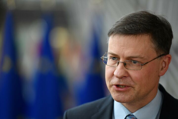 European Commissioner for Trade Valdis Dombrovskis answers journalists' questions ahead of a Eurogroup meeting at the EU headquarters in Brussels on March 14, 2022. (Photo by John THYS / AFP)