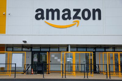 © AFP A picture shows the Amazon logo on the frontage of an Amazon's centre in Bretigny-sur-Orge, on December 14, 2021. (Photo by Thomas SAMSON / AFP)