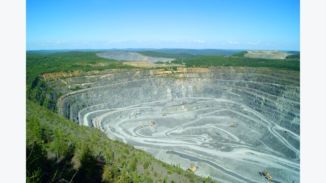 RUSSIA, KACHKANAR - JUNE 18, 2016: extraction of bauxite by open method in the quarry of the Kachkanarsky ore mining and processing enterprise, Sverdlovsk region.