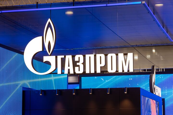 Gazprom logo and sign at the stand in the exhibition pavilion. Russian energy company Gazprom. Moscow, Russia - April 28, 2021.