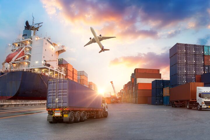 Container truck in ship port for business Logistics and transportation of Container Cargo ship and Cargo plane with working crane bridge in shipyard at sunrise, logistic import export and transport industry background