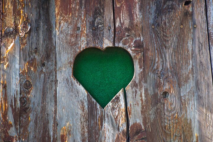 Old vintage heart-shaped wooden fence detail