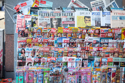 © Getty Images Picture of a press kiosk in the center of Vienna, Austria, filled with newspapers aligned in a magazine rack, all in German language.
