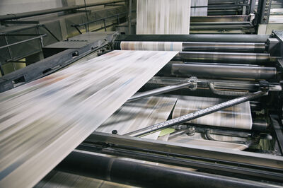 © Getty Images Newspapers being printed in printing press.