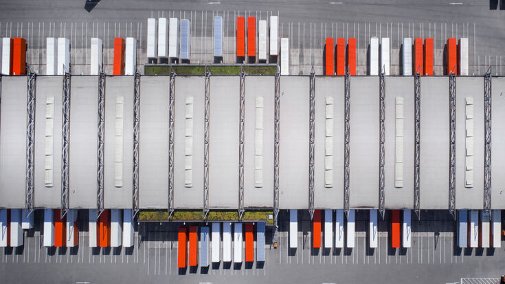 © Getty Images Distribution logistics building parking lot - aerial view