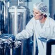 hygiene staff worker in foods and drinks clean factory. working women in water plant industry quality control check.