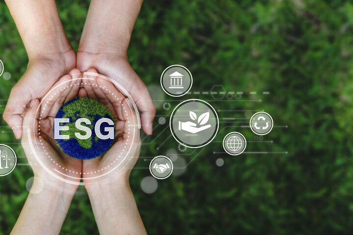 ESG icon concept and earth in the hand for environmental, social, and governance in sustainable corporation development and ethical business on a green background whith Copy space.