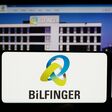 Stuttgart, Germany - 09-14-2023: Person holding smartphone with logo of German construction company Bilfinger SE on screen in front of website. Focus on phone display.