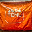 Orange Temu Package close up - Delligsen, Germany, January 15, 2024