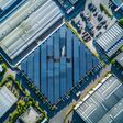 Aerial view of a solar panel-covered industrial estate, demonstrating environmental sustainability