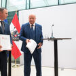 (L-R): Chairman of the Social Democratic Party of Austria (SPOe) Andreas Babler, Chairman of the Austrian People's Party (OeVP) Christian Stocker and Chairwoman of the liberal NEOS Beate Meinl-Reisinger hold copies of their parties' coalition program at the parliament in Vienna, Austria, on February 27, 2025. (Photo by Alex HALADA / AFP)