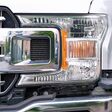 Minsk, Belarus. May 10, 2024. Ford truck F-150 XLT headlight closeup, sleek and modern design of the headlamp. F150 without front bumper cover grille upper molding. Selective focus
