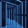 A modern server room is bathed in blue neon light, highlighting rows of server racks. This image represents cutting-edge technology, data storage, and the digital infrastructure that powers the