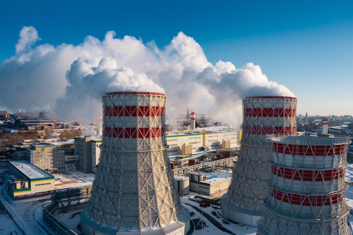 Concept of environmental pollution, drone view of smokestack pipe steel plant, aerial industrial panoramic landscape with blue sky in winter evening, air emissions from manufacturing sector,Russia