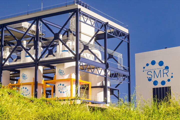 concept of a SMR small modular nuclear reactor power plant on a sunny day. SMR is a future energy concept. 3d rendering.