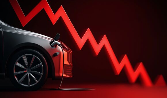 Electric vehicle with charging cable and a red downward trend line indicating a drop in ev sales.