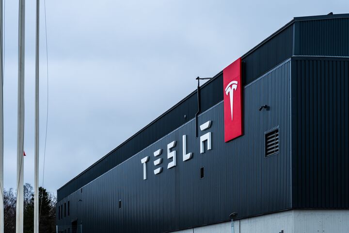 Tesla, factory, building, logo, industry, manufacturing, electric, vehicle, EV, technology, innovation, production, automation, architecture, modern, corporate, branding, engineering, futuristic, clean energy, sustainability, environment, transportation, automotive, design, business, economy, structure, infrastructure, company, headquarters, development, power, efficiency, electric cars, clean tech, corporate identity, branding, factory exterior, industrial facility, logistics, warehouse, flagpoles, industrial architecture, tesla, factory, building, logo, industry, manufacturing, electric, vehicle, ev, technology, innovation, production, automation, architecture, modern, corporate, branding, engineering, futuristic, clean energy, sustainability, environment, transportation, automotive, design, business, economy, structure, infrastructure, company, headquarters, development, power, efficiency, electric cars, clean tech, corporate identity, factory exterior, industrial facility, logistics, warehouse, flagpoles, industrial architecture