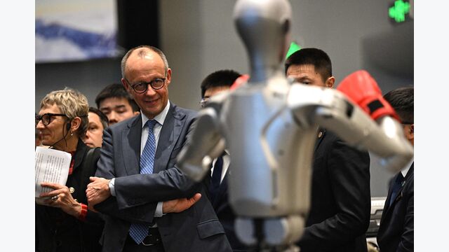 Germany's Chancellor Friedrich Merz visits a showroom of Unitree Robotics products in Hangzhou