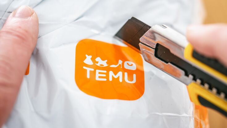 Aachen, Germany - February 21, 2024: Shipping package of TEMU a giant new Chinese mail order company.
