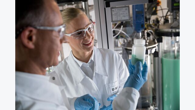 Research on high-performance battery materials - BASF is conducting research on innovative cathode active materials for high-performance lithium-ion batteries. The cathode active material usually consist of mixed metal oxides. Physical laboratory technician Joerg Mai (left) and chemist Dr. Daniela Pfister (right) examine a sample of metal hydroxides.
