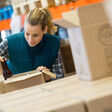distillery packaging worker inspecting the product in the box